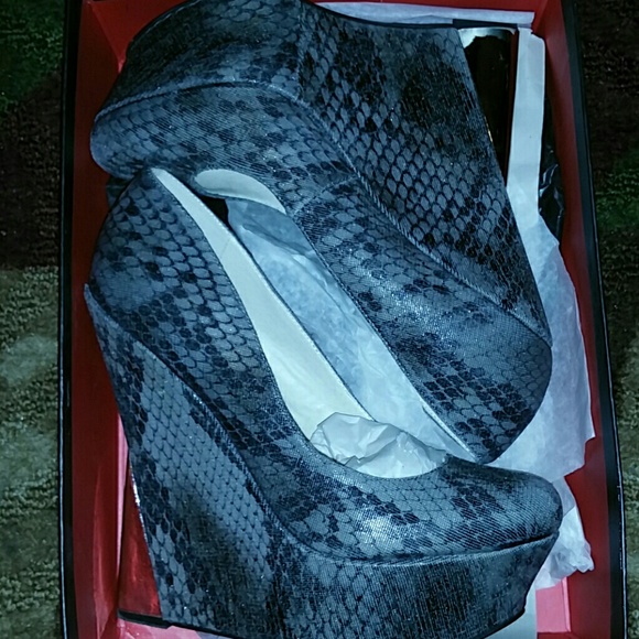 Giselle by Wild Pair snake print wedge heels