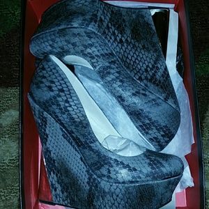 Giselle by Wild Pair snake print wedge heels