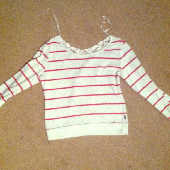 Sweater with lace back. Fits more like a small