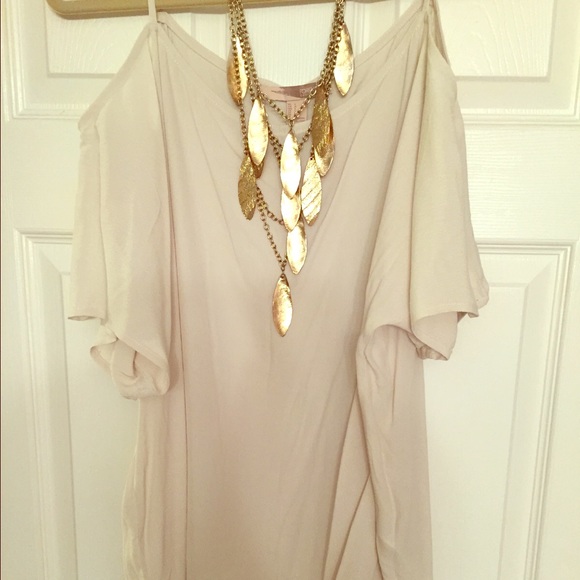 Off the shoulder blouse with back slit.