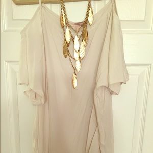 Off the shoulder blouse with back slit.