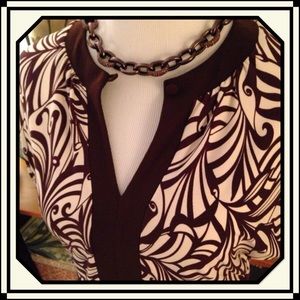 Brown & white patterned dress.
