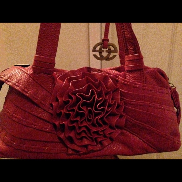 Red clutch bag intricate flower.