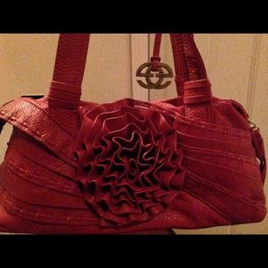 Red clutch bag intricate flower.
