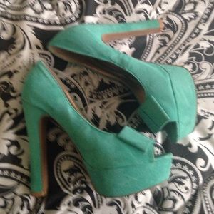 Teal green peep toe platform heels. Worn once.