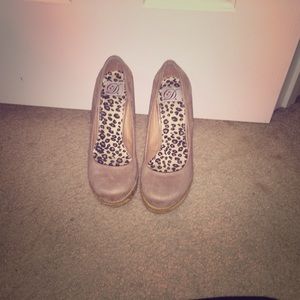 Cute pair of beige wedges.