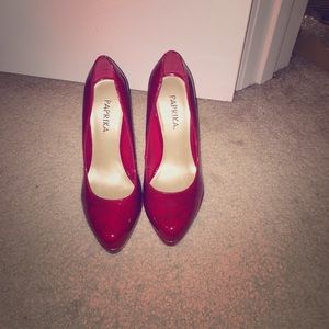 Cute pair of red patten leather heels.