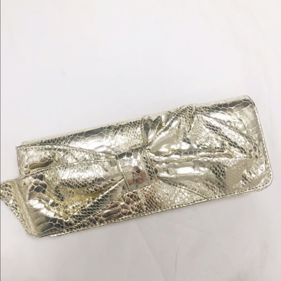 Gold snake embossed clutch