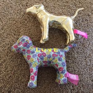 Two vs pink plush dogs