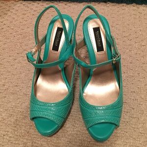 Never worn. Green scrappy heels.
