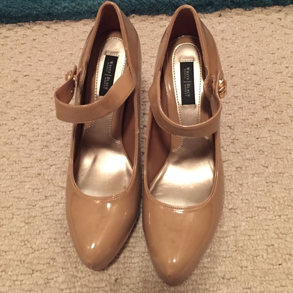 Dark nude Mary Jane pumps.