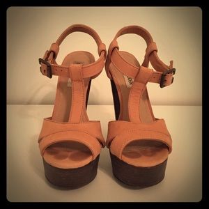 Champagne pink sandal with wood base and heel.