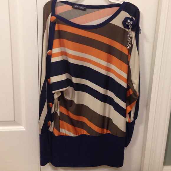 Blue, badge, orange and brown striped shirt.