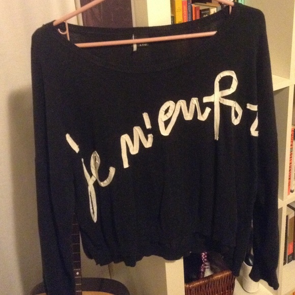 Blue sweater with French writing