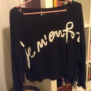 Blue sweater with French writing