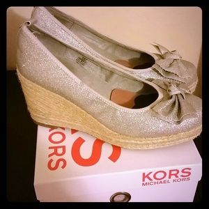 I am selling sparkeling bow michael kors shoes.