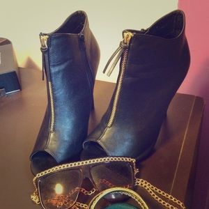 Black peep toe booties with gold accent zipper
