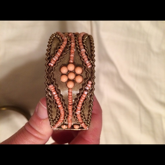Gold cuff with coral beaded accent