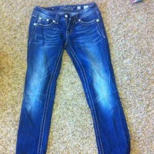 pair of perfect conditioned miss me jeans.