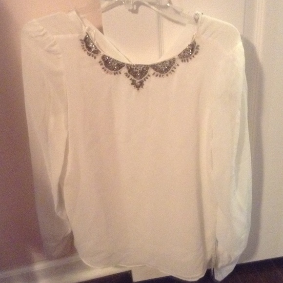 Gorgeous white blouse with detailing along neck