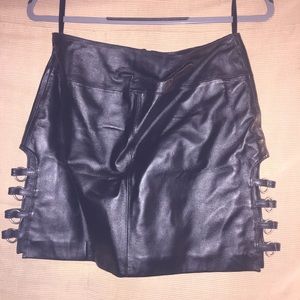 Leather mini skirt with gromet detail