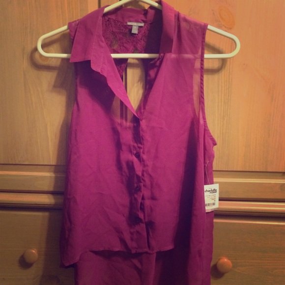BRAND NEW. Button up sleeveless shirt.