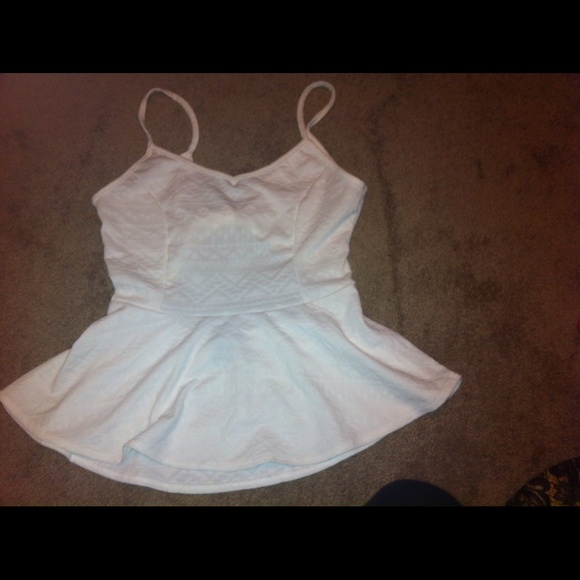 White Aztec print peplum top.
