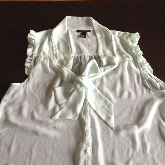 Mint green sleeveless blouse