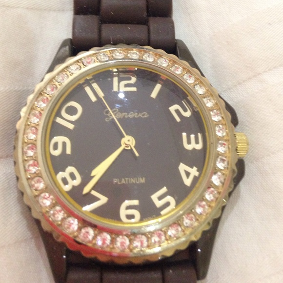 Brown watch with rhinestones around the face