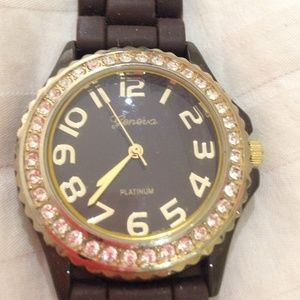 Brown watch with rhinestones around the face