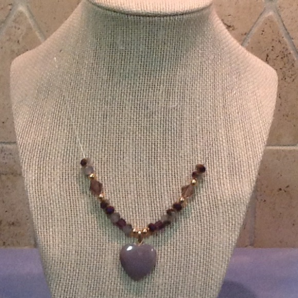 Floating heart pendant with purple accents