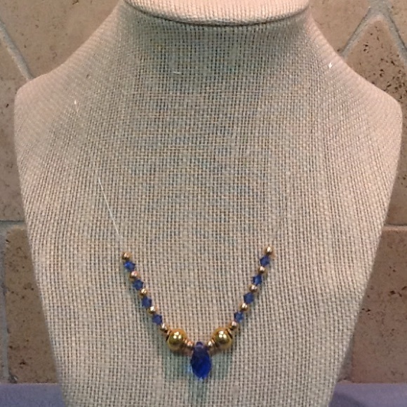 Beautiful Blue floating necklace with gold tone