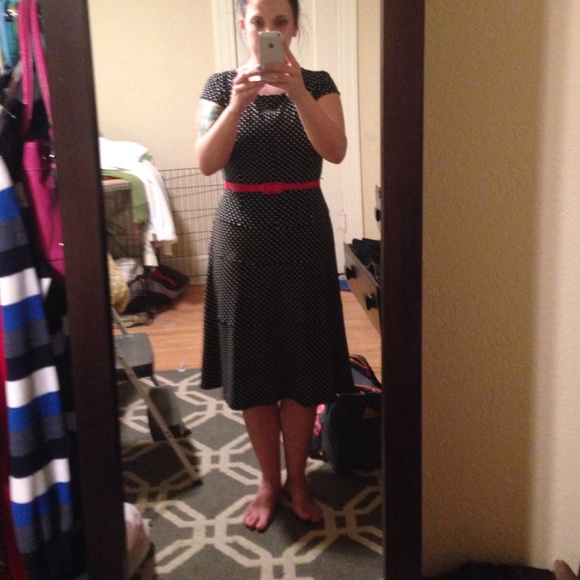 Black and white polka dot dress with red belt