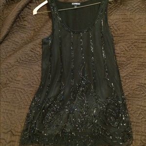 Sequin black top with scallop bottom.