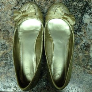 Gold ballet flats with bows