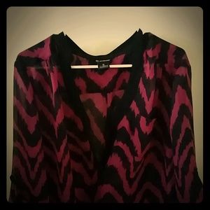 A purple and black chevron print blouse with shoes