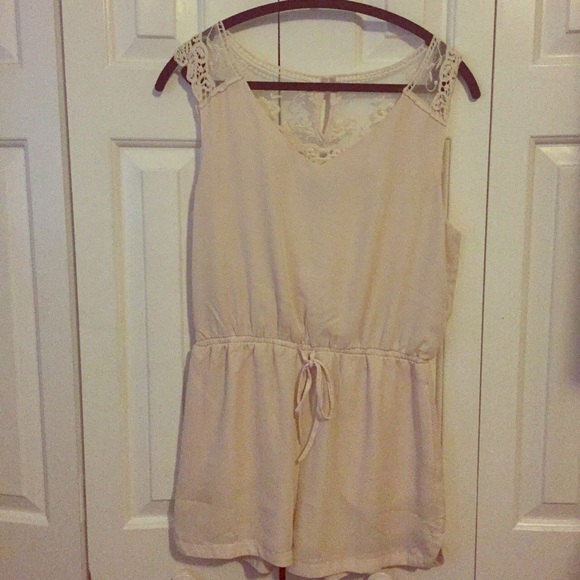 Cream romper with lace back detail