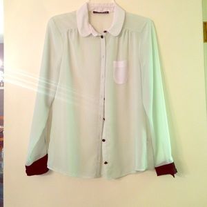 Long sleeve blouse. Light mint, black, and white.