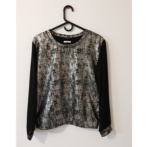 A metallic shirt bought at a small boutique.