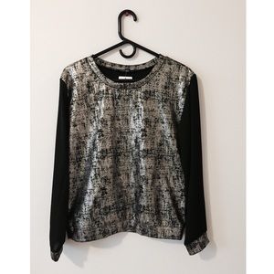 A metallic shirt bought at a small boutique.