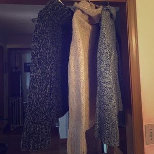 Three large express sweaters