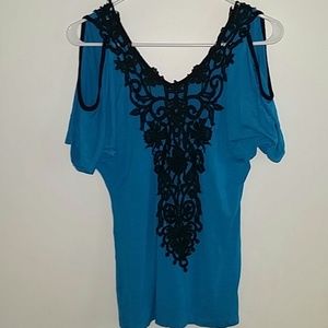Bright blue top with crochet details