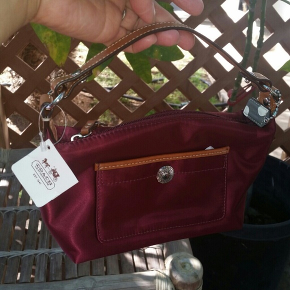 New authentic Coach  Bordeaux satin clutch bag