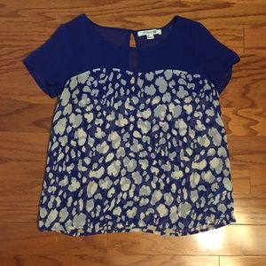 A blue with white leopard short sleeve shirt!