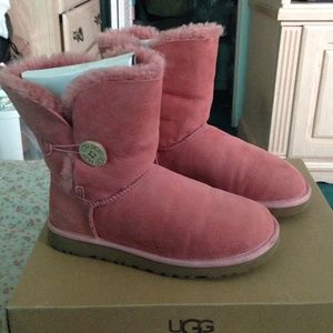 Short pink uggs with button.