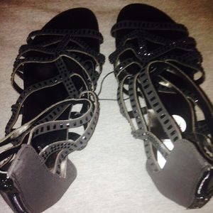 A pair of black sandals brand new