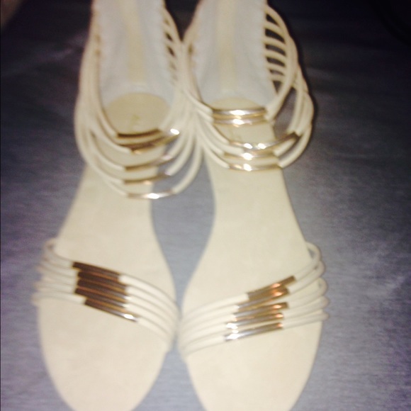 A pair of cream and gold sandals brand new size 11