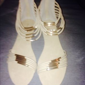 A pair of cream and gold sandals brand new size 11