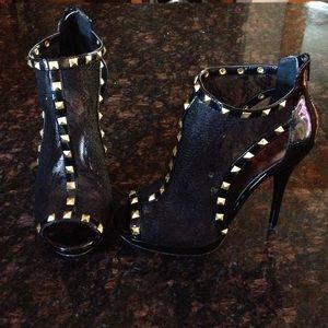 Black 6-inch heel with gold studs and lace.