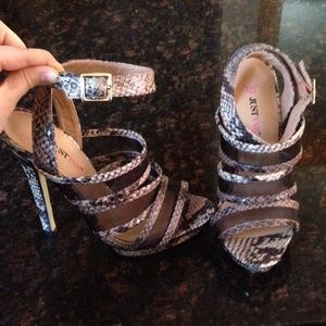 Snake-skin 6-inch heels with black mesh straps.